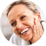 Smiling woman after microneedling facial